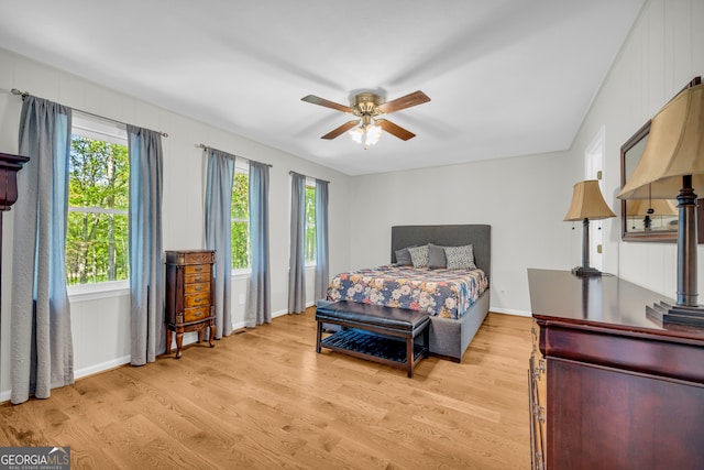 bedroom featuring light hardwood / wood-style floors and ceiling fan