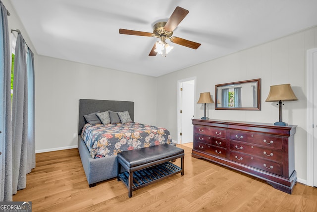 bedroom featuring light wood-type flooring and ceiling fan