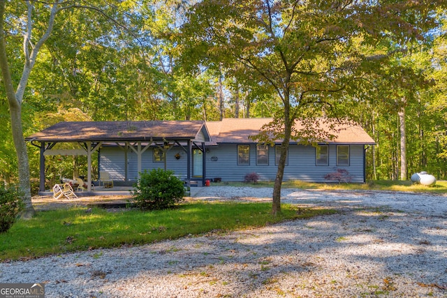 single story home featuring a front yard and a patio