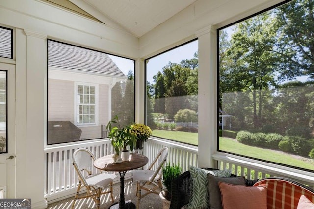 sunroom with vaulted ceiling