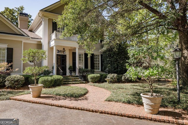 doorway to property with a balcony