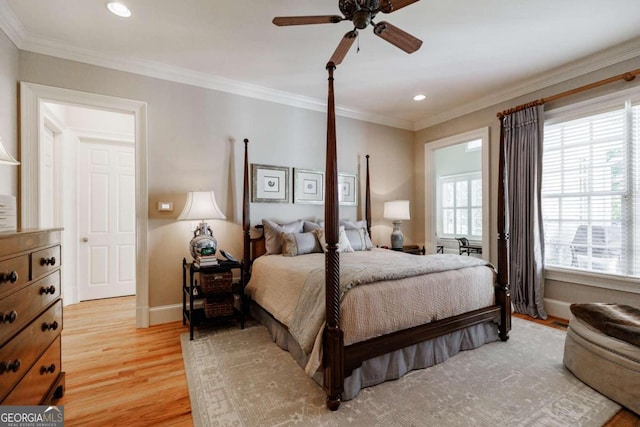 bedroom featuring crown molding, ceiling fan, and hardwood / wood-style floors