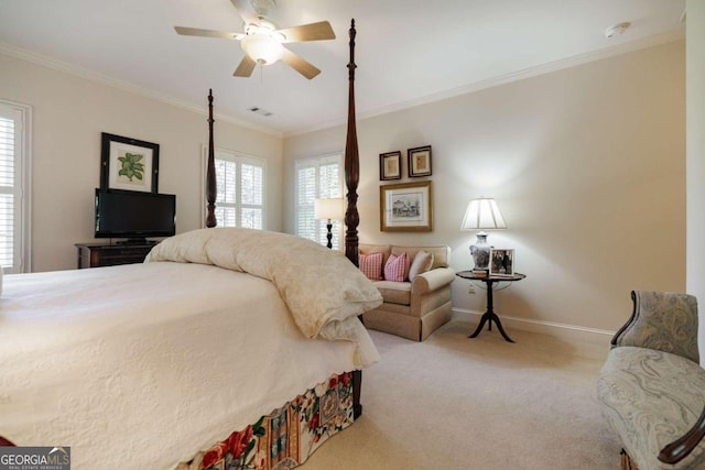 bedroom with ceiling fan, crown molding, light carpet, and multiple windows