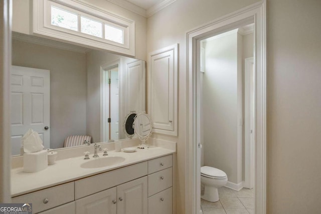 bathroom featuring crown molding, tile patterned floors, vanity, and toilet