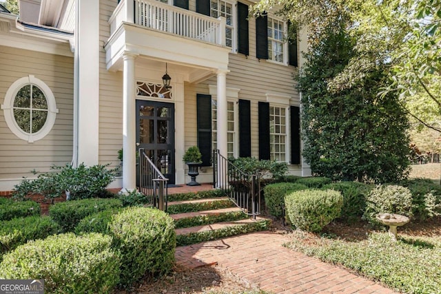 property entrance with a balcony