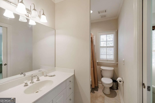 bathroom featuring tile patterned flooring, ornamental molding, vanity, and toilet