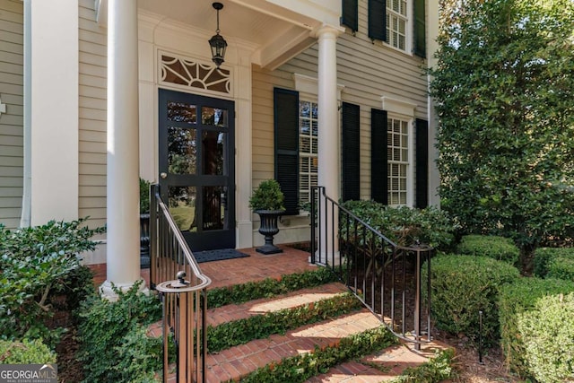 entrance to property featuring a porch