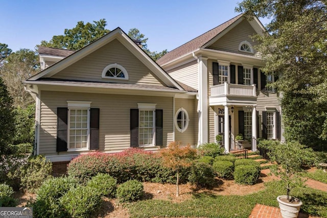 view of front of property with a balcony