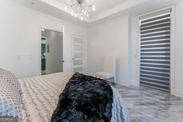 bedroom featuring baseboards, a tray ceiling, ornamental molding, an inviting chandelier, and marble finish floor