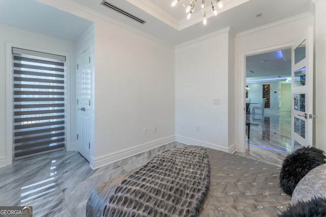bedroom featuring an inviting chandelier, crown molding, visible vents, and baseboards