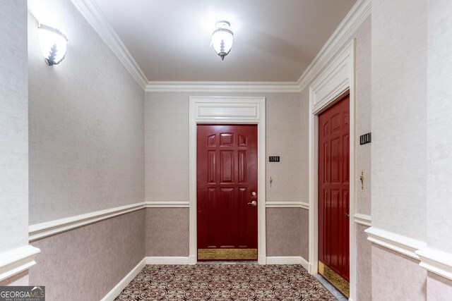 interior space featuring baseboards and ornamental molding