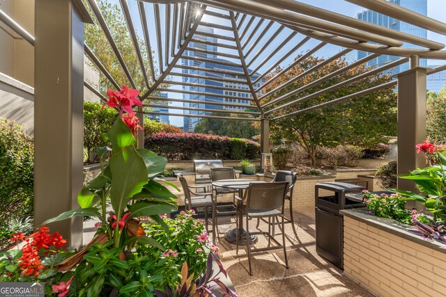 view of patio / terrace featuring outdoor dining space and a pergola