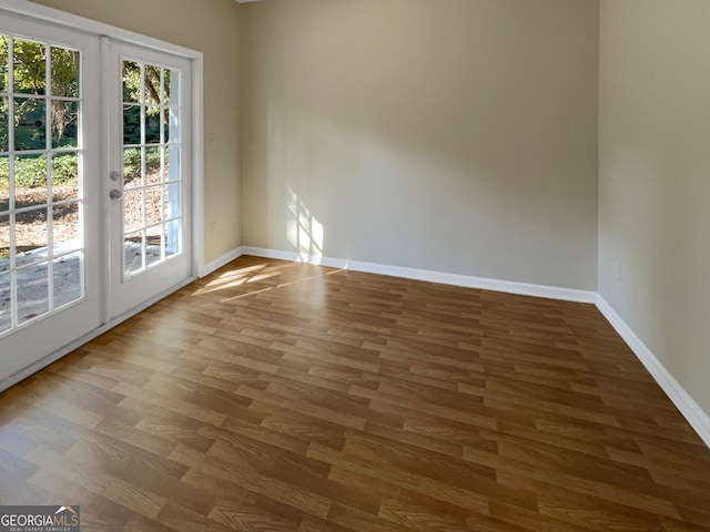 spare room featuring wood-type flooring