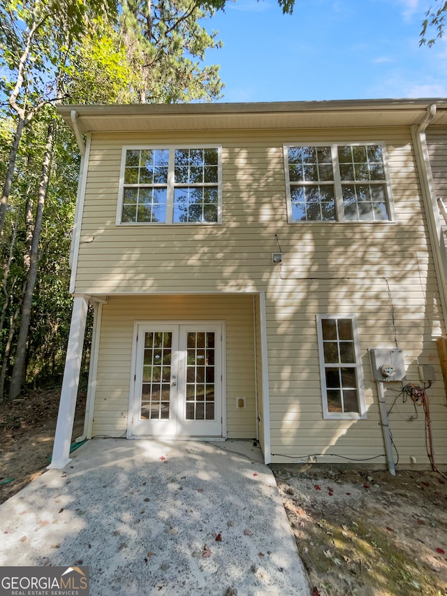 back of property featuring a patio