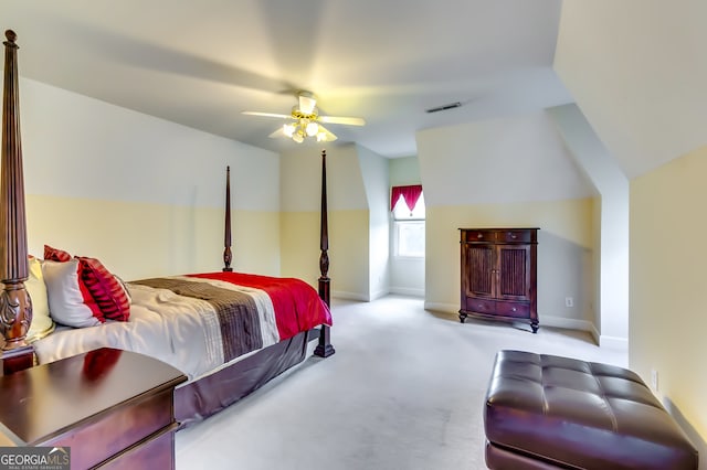 bedroom with lofted ceiling, light carpet, and ceiling fan