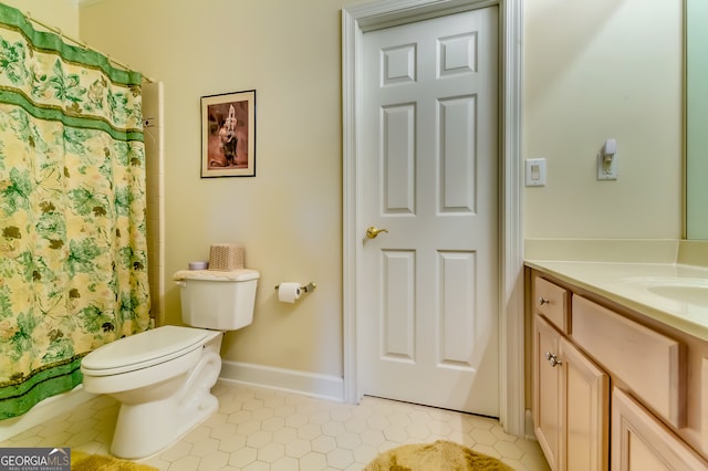 bathroom with tile patterned flooring, curtained shower, vanity, and toilet