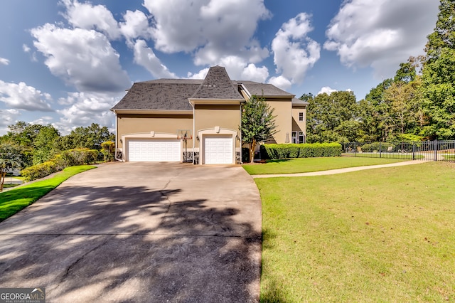 view of front facade featuring a front lawn and a garage