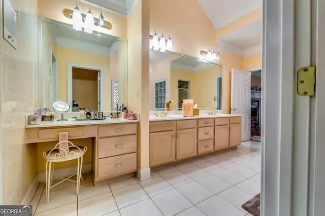 bathroom with tile patterned flooring, crown molding, and vanity