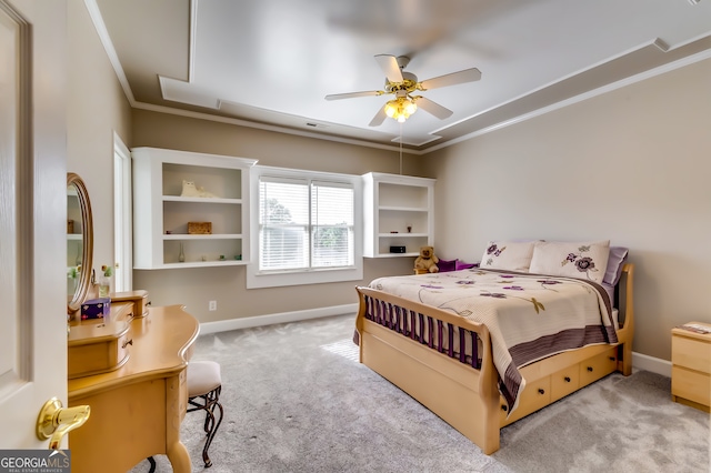 carpeted bedroom with crown molding and ceiling fan