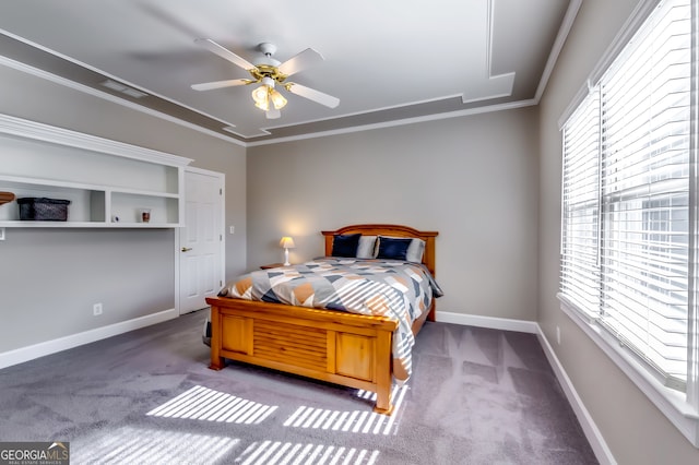 carpeted bedroom featuring ceiling fan and ornamental molding