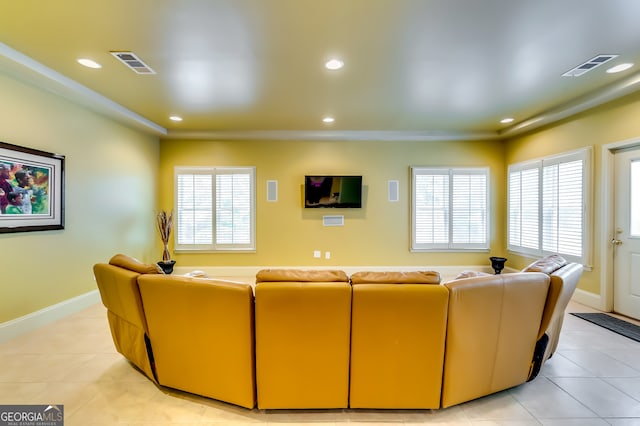 living room featuring plenty of natural light and light tile patterned floors