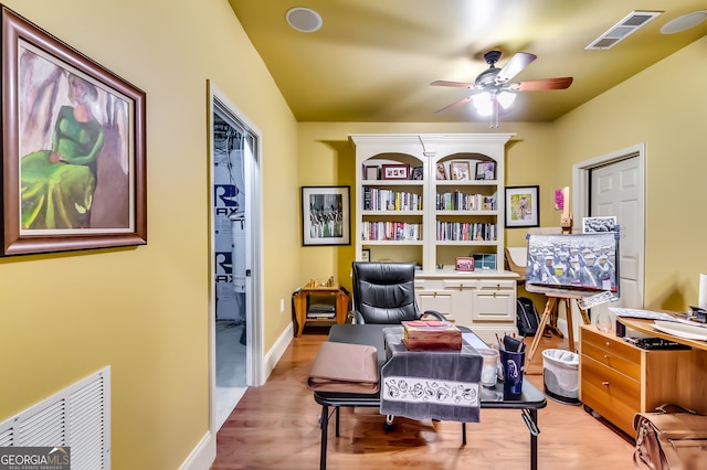 office space featuring light hardwood / wood-style flooring and ceiling fan