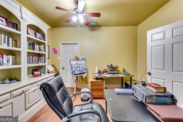 office featuring hardwood / wood-style flooring and ceiling fan