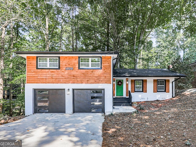 view of front of property with a garage