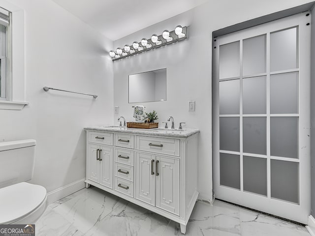 bathroom with vanity and toilet