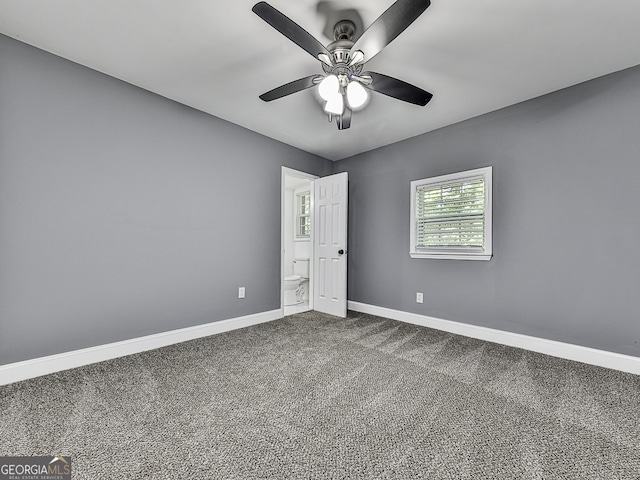 unfurnished bedroom with ceiling fan and carpet floors