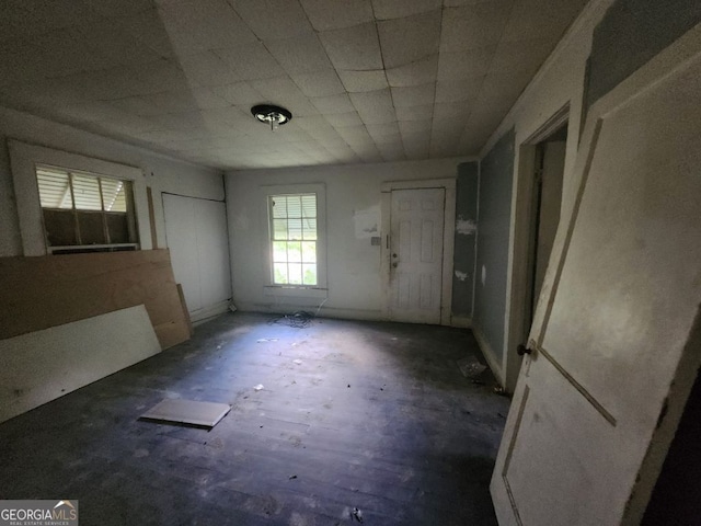 unfurnished room featuring dark wood-type flooring