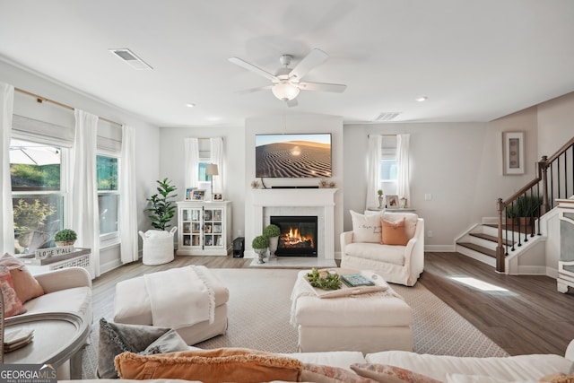 living room with ceiling fan and hardwood / wood-style floors