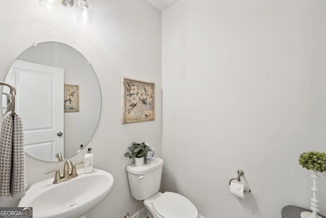 bathroom featuring sink and toilet