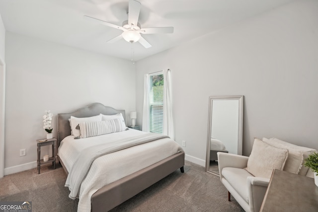 bedroom featuring ceiling fan and dark colored carpet