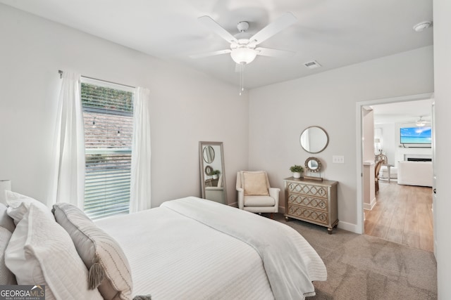 bedroom featuring light wood-type flooring and ceiling fan