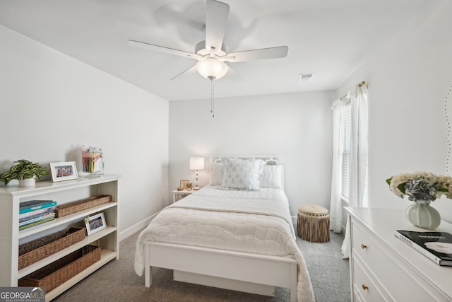 bedroom with ceiling fan and carpet floors