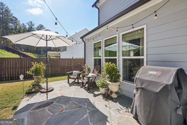 view of patio featuring a grill