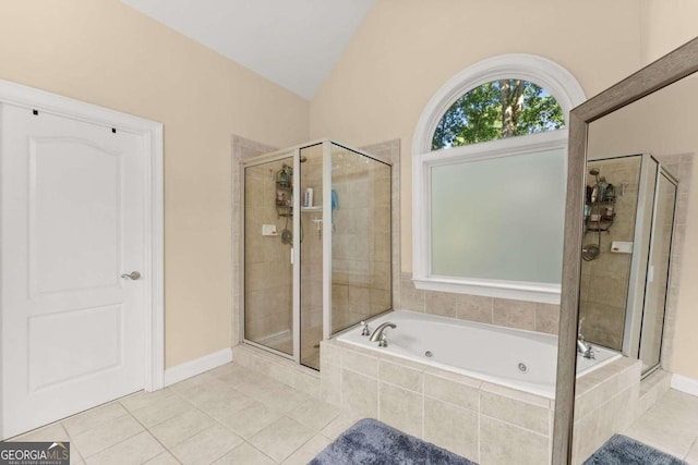 bathroom with vaulted ceiling, tile patterned floors, and separate shower and tub