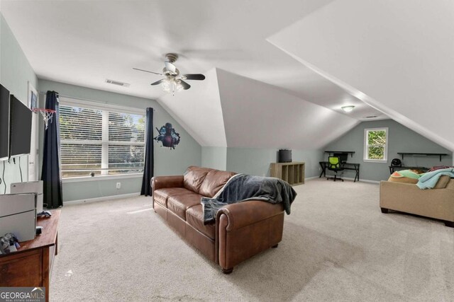 living room with carpet, vaulted ceiling, and ceiling fan