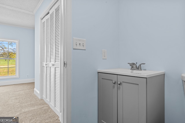 bathroom with vanity and a textured ceiling