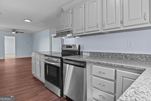 kitchen with ceiling fan, dark wood-type flooring, a textured ceiling, appliances with stainless steel finishes, and white cabinetry