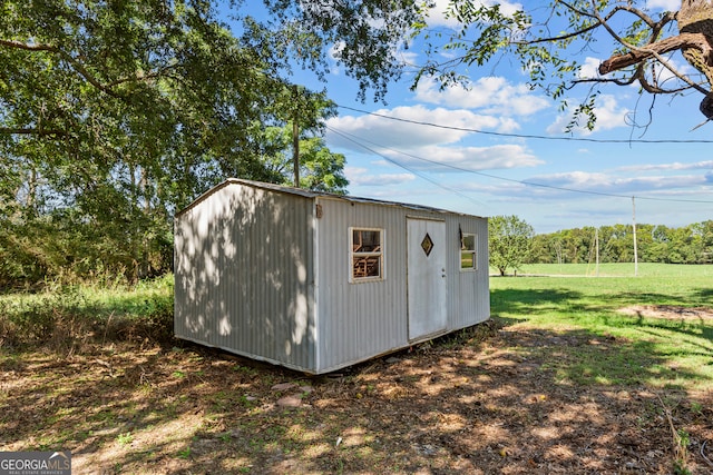 view of outdoor structure with a lawn