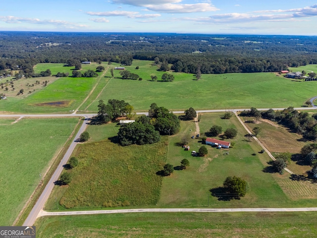 birds eye view of property featuring a rural view