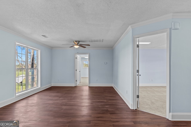 unfurnished room featuring ceiling fan, ornamental molding, a textured ceiling, and dark hardwood / wood-style flooring