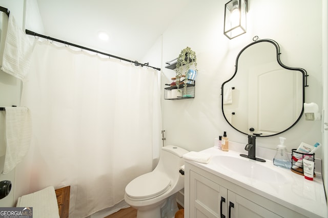 bathroom with wood-type flooring, vanity, toilet, and a shower with shower curtain