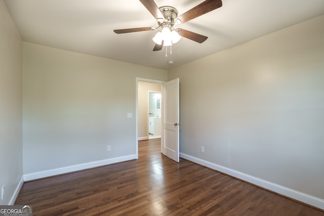 spare room featuring ceiling fan and dark hardwood / wood-style flooring