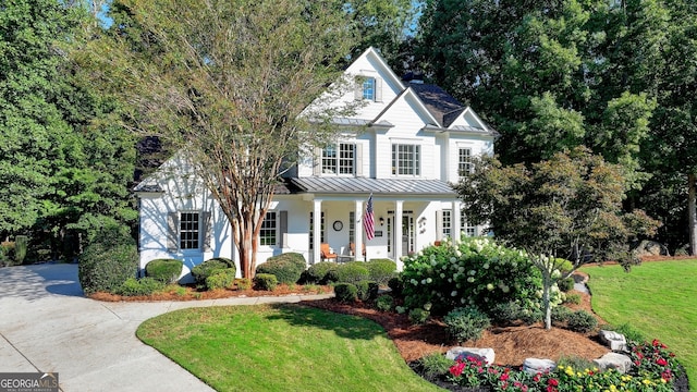 view of front of house with a front lawn and a porch