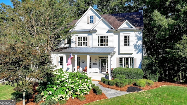 view of front of house featuring a porch and a front yard