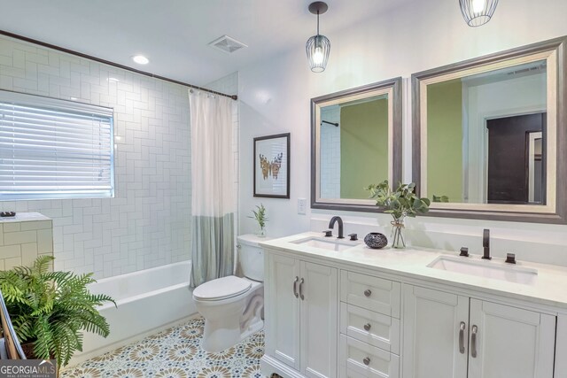 full bathroom with toilet, shower / bath combo, vanity, and tile patterned flooring