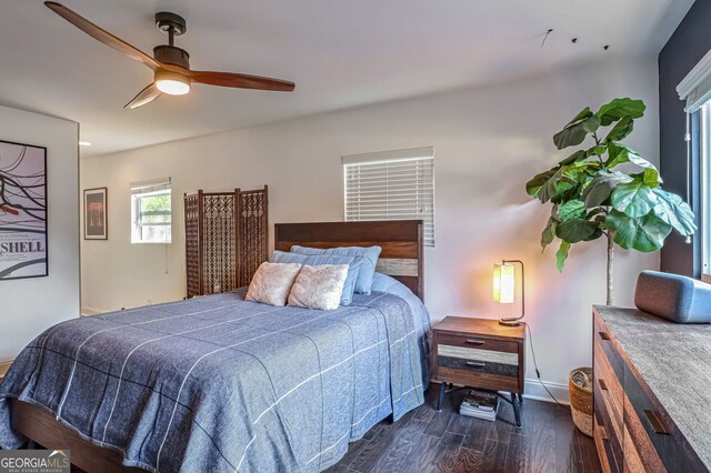 bedroom featuring ceiling fan and dark hardwood / wood-style flooring